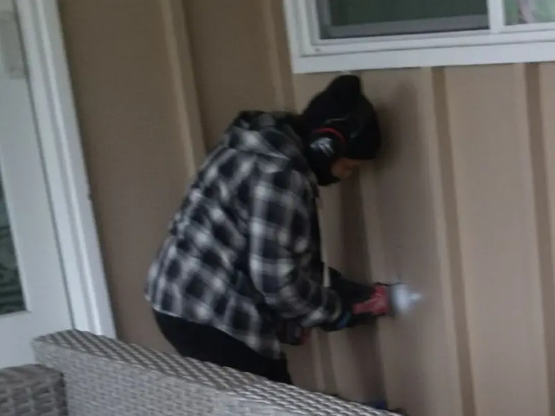 Professional electrician installing an exterior outlet in Parker